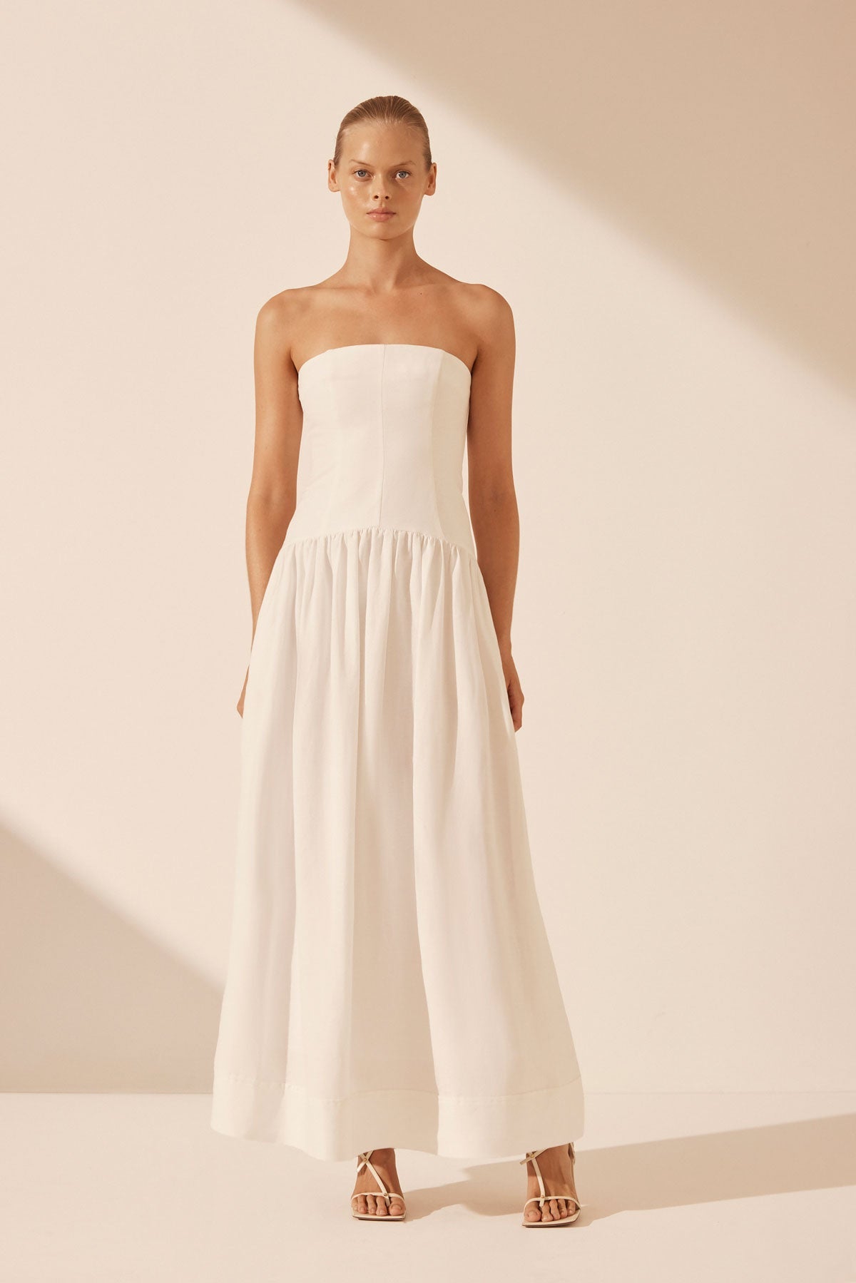 blanc linen strapless panelled maxi dress Back in Stock @samispalter wears the Blanc Linen Strapless Panelled Maxi Dress. Shop now before it's gone again. #ShonaJoy