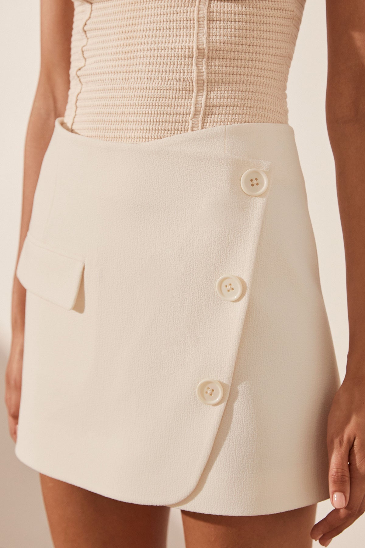 Amura Asymmetrical Button Mini Skirt Cream Skirts Shona Joy