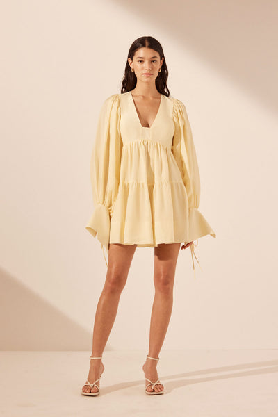 Yellow long store sleeve mini dress